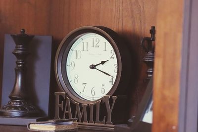 Close-up of clock on table