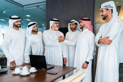 Low angle view of doctors standing in office