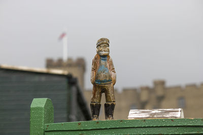 Rear view of statue against clear sky