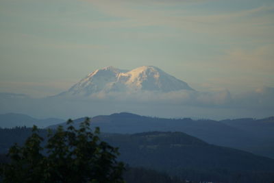 Scenic view of mountains against sky during sunset