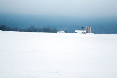 Scenic view of snow covered land