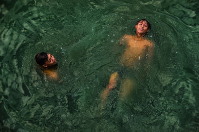 High angle view of man swimming in water