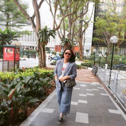 Portrait of a smiling young woman standing outdoors