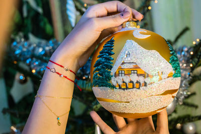 Close-up of hand holding umbrella