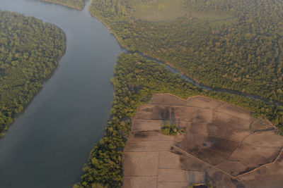 Aerial view of green landscape and river