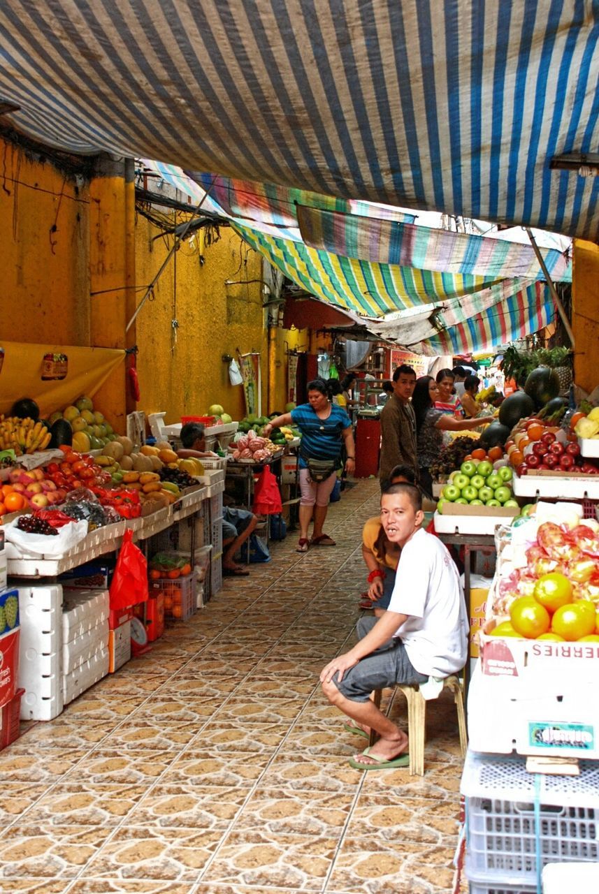 retail, market, casual clothing, for sale, store, full length, market stall, lifestyles, indoors, men, rear view, small business, leisure activity, person, shopping, selling, large group of objects