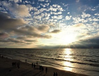 Scenic view of beach against sky during sunset