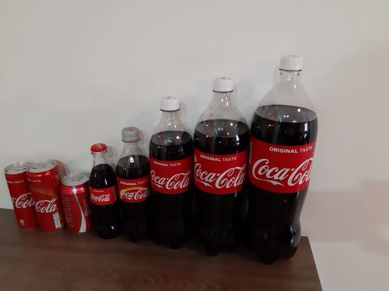 CLOSE-UP OF WINE BOTTLES ON TABLE