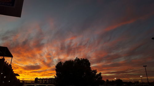 Low angle view of cloudy sky at sunset