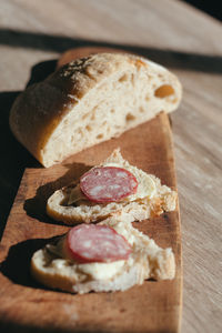 High angle view of bread on cutting board