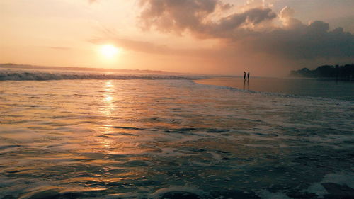 Scenic view of sea at sunset