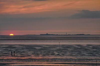 Scenic view of landscape against sky during sunset