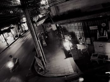 High angle view of illuminated street amidst buildings