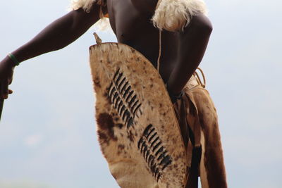 Low angle view of woman against sky