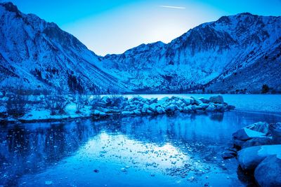 Scenic view of lake against mountain range