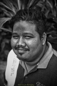 Close-up portrait of a smiling young man