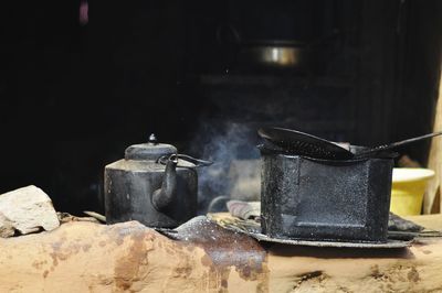 Close-up of kettle and container at shop