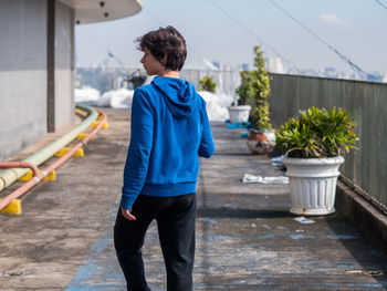 Rear view of man standing outdoors