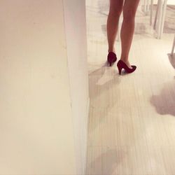 Low section of woman standing on tiled floor