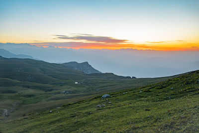 Scenic view of landscape against sky during sunset