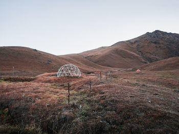 Scenic view of field against clear sky