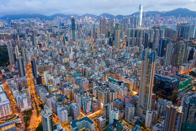 High angle view of city buildings against sky