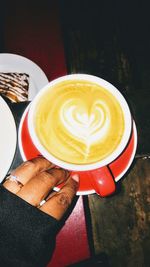 Close-up of cappuccino served on table