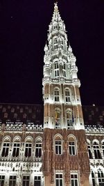 Low angle view of illuminated building at night