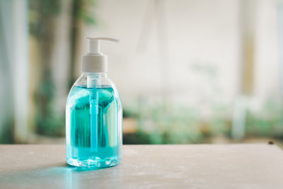 Close-up of glass bottle on table