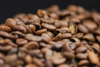 Close-up of coffee beans on table