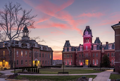 Buildings in city at sunset