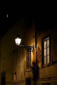 Low angle view of illuminated street light at night