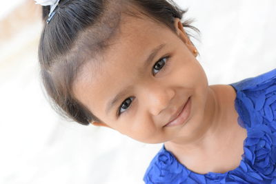 Close-up portrait of a smiling young woman