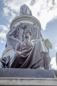 Low angle view of statue against sky