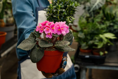 Midsection of woman holding bouquet