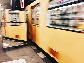 Blurred motion of train at railroad station