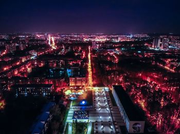 High angle view of illuminated city buildings at night