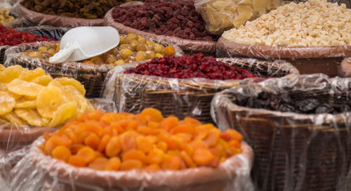 Dried fruits in baskets at market