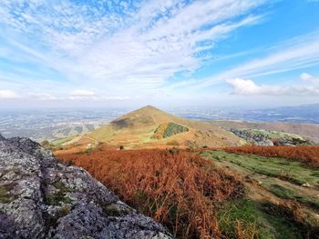 Scenic view of landscape against cloudy sky