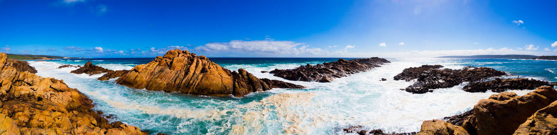 Scenic view of sea against blue sky