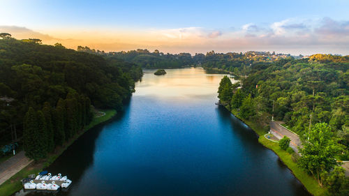 Scenic view of river against sky during sunset
