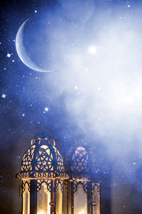 Low angle view of moon against sky at night