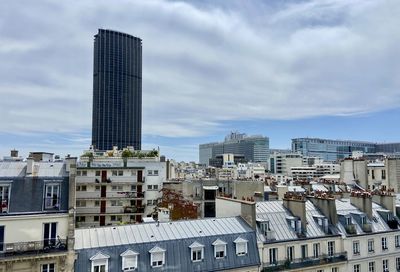 Buildings in city against sky