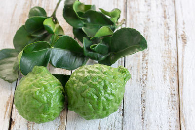 Close-up of green leaves on table