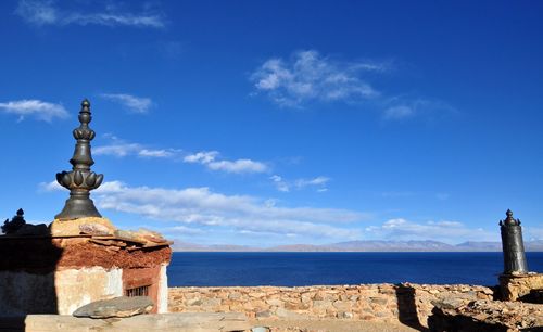 Scenic view of sea against blue sky