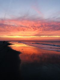 Scenic view of sea against romantic sky at sunset