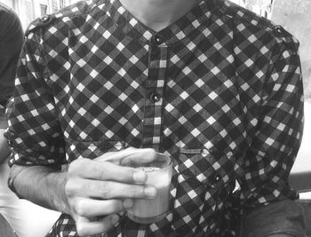 Cropped image of person holding hands