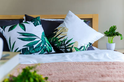 Close-up of white table on bed at home