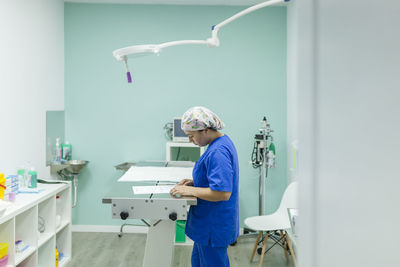 Healthcare worker examining document in veterinary clinic