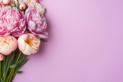 Close-up of rose bouquet against pink background